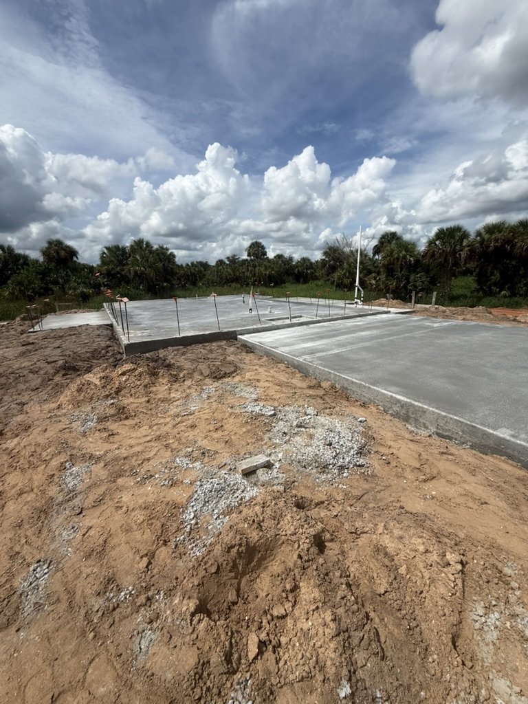Poured concrete slab for the in-law suite on the Riddle family's Golden Gate Estates build
