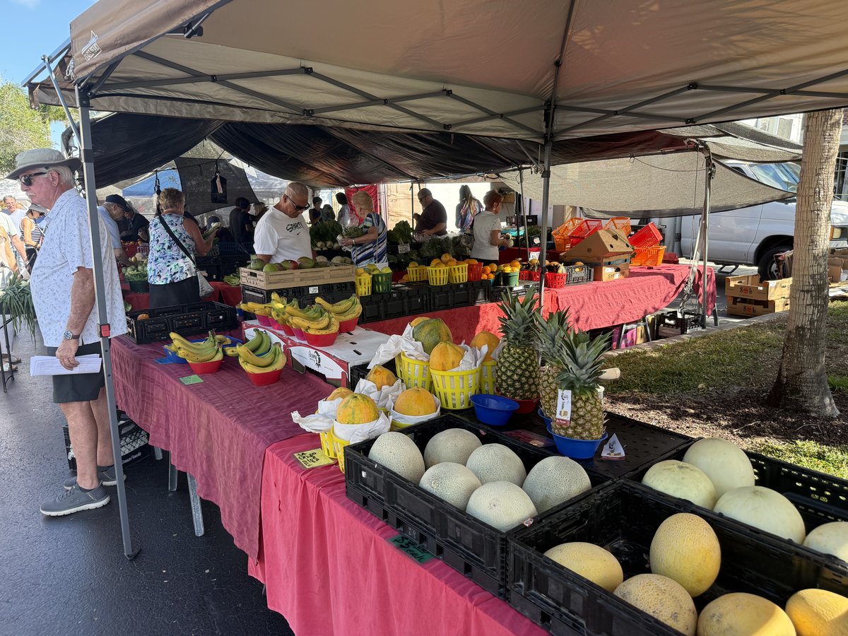 Fresh produce stand at the Vanderbilt Farmers Market in Naples